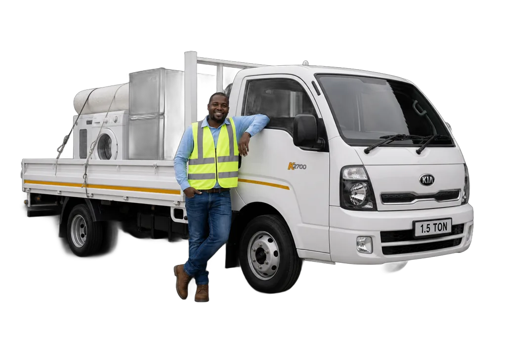 White Kia K2700 truck with a worker standing beside the cab